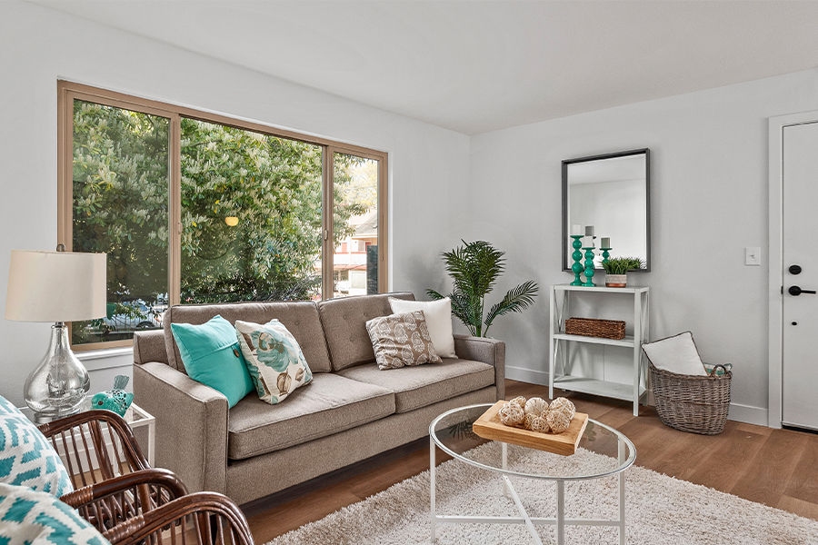 living room interior with large window to Magnolia neighborhood