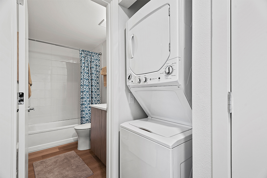 stacking washer and dryer outside apartment bathroom