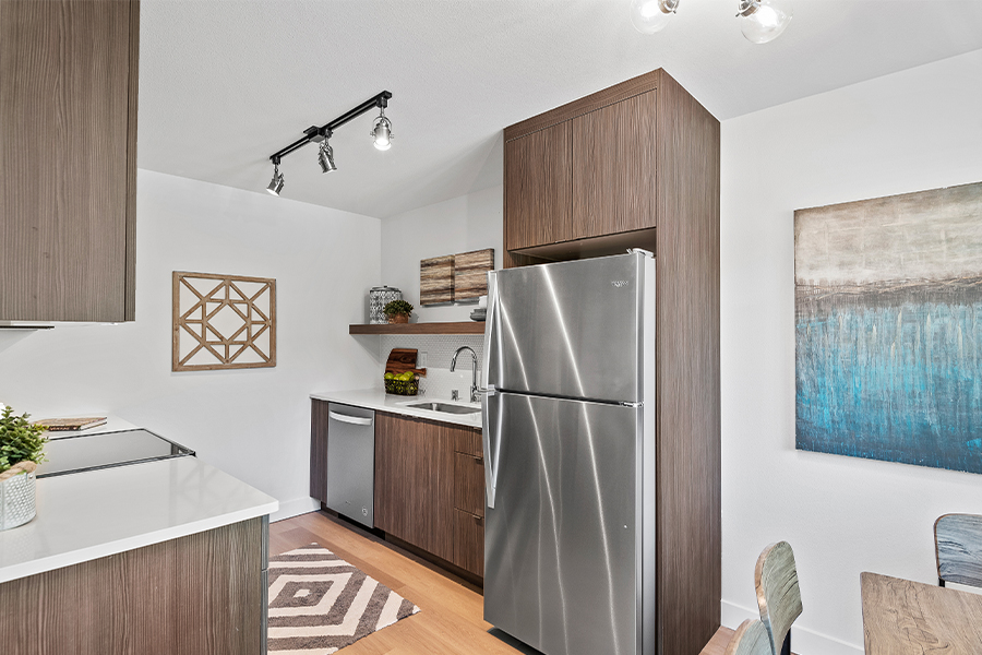interior of kitchen at Maggie apartments with stainless appliances