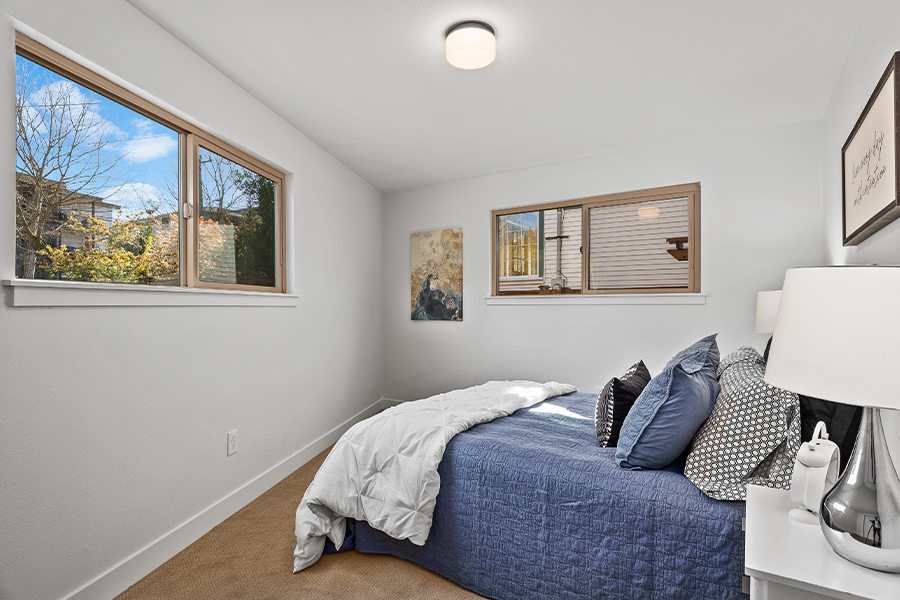 bedroom interior with window to Seattle neighborhood